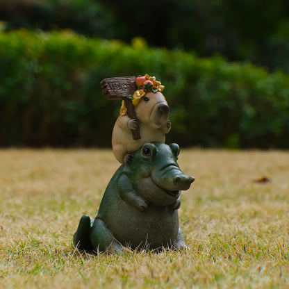 Whimsical capybara on alligator outdoor decor statue 