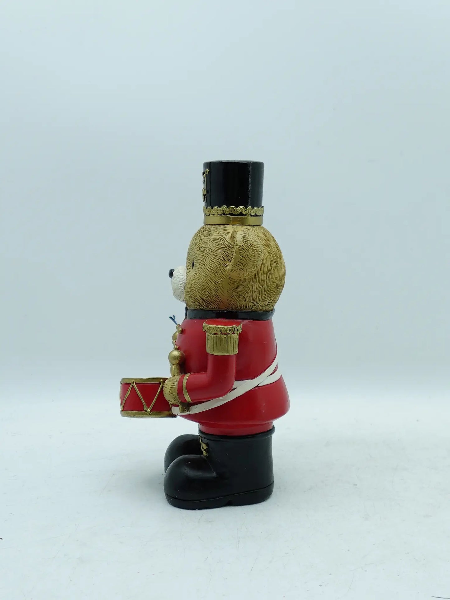 the teddy bear drummer figurine in red uniform, side view