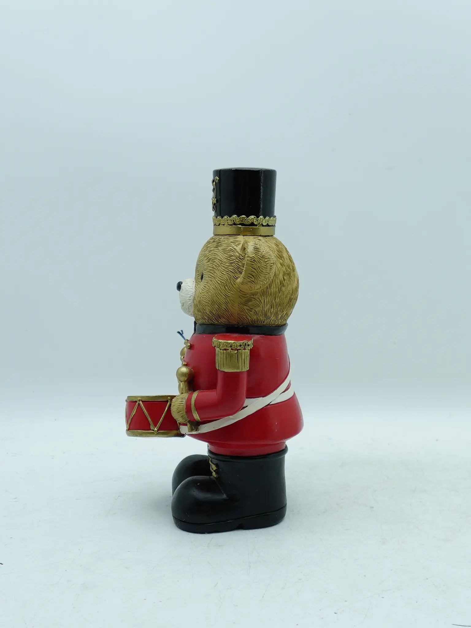 the teddy bear drummer figurine in red uniform, side view