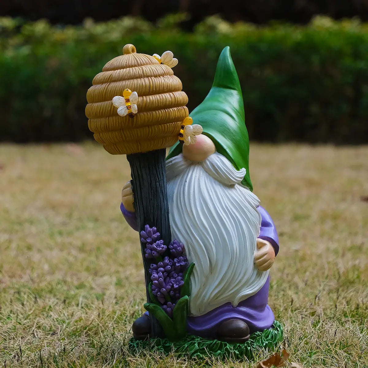Lighted garden gnome figurine holding beehive staff with bees, purple outfit outdoor decor