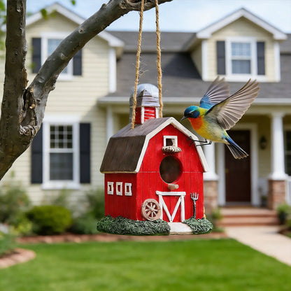 Colorful bird flying near red farmhouse birdhouse 