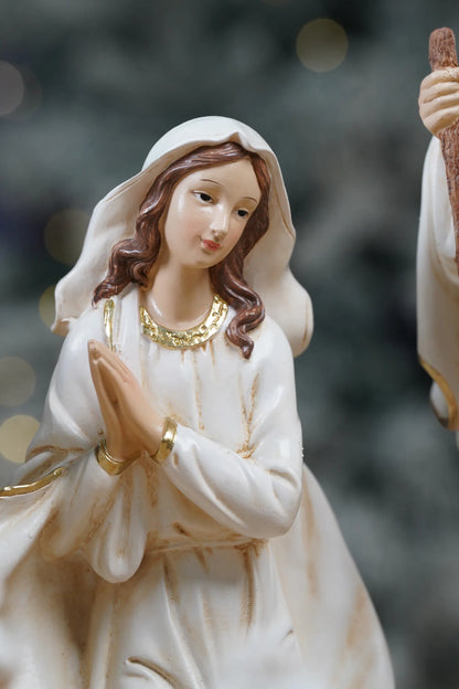 White and gold Virgin Mary nativity figurine close-up