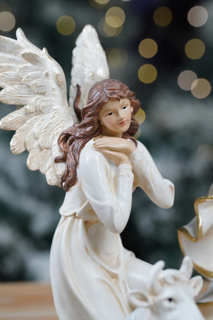 White and gold nativity angel figurine close-up