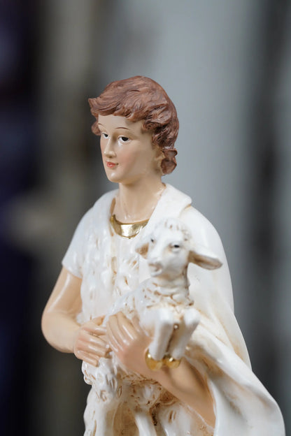 White and gold nativity shepherd figurine close-up