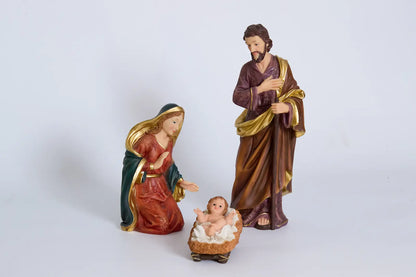 Holy Family three-piece nativity set on white background, hand-painted Christmas creche.