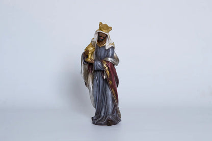 Nativity King Balthazar close-up — hand-painted resin Magi figurine holding gold gift vessel