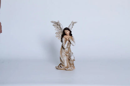 Nativity angel close-up — hand-painted resin figurine with feathered wings