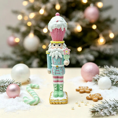 A festive Christmas nutcracker figurine styled on a tabletop with a blurred Christmas tree in the background. 