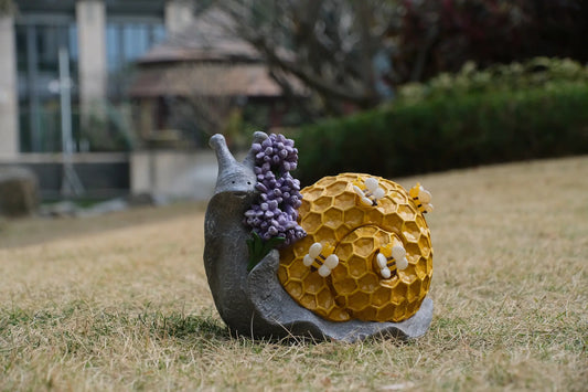 Whimsical bee snail solar garden light decor displayed outdoors as yard accent