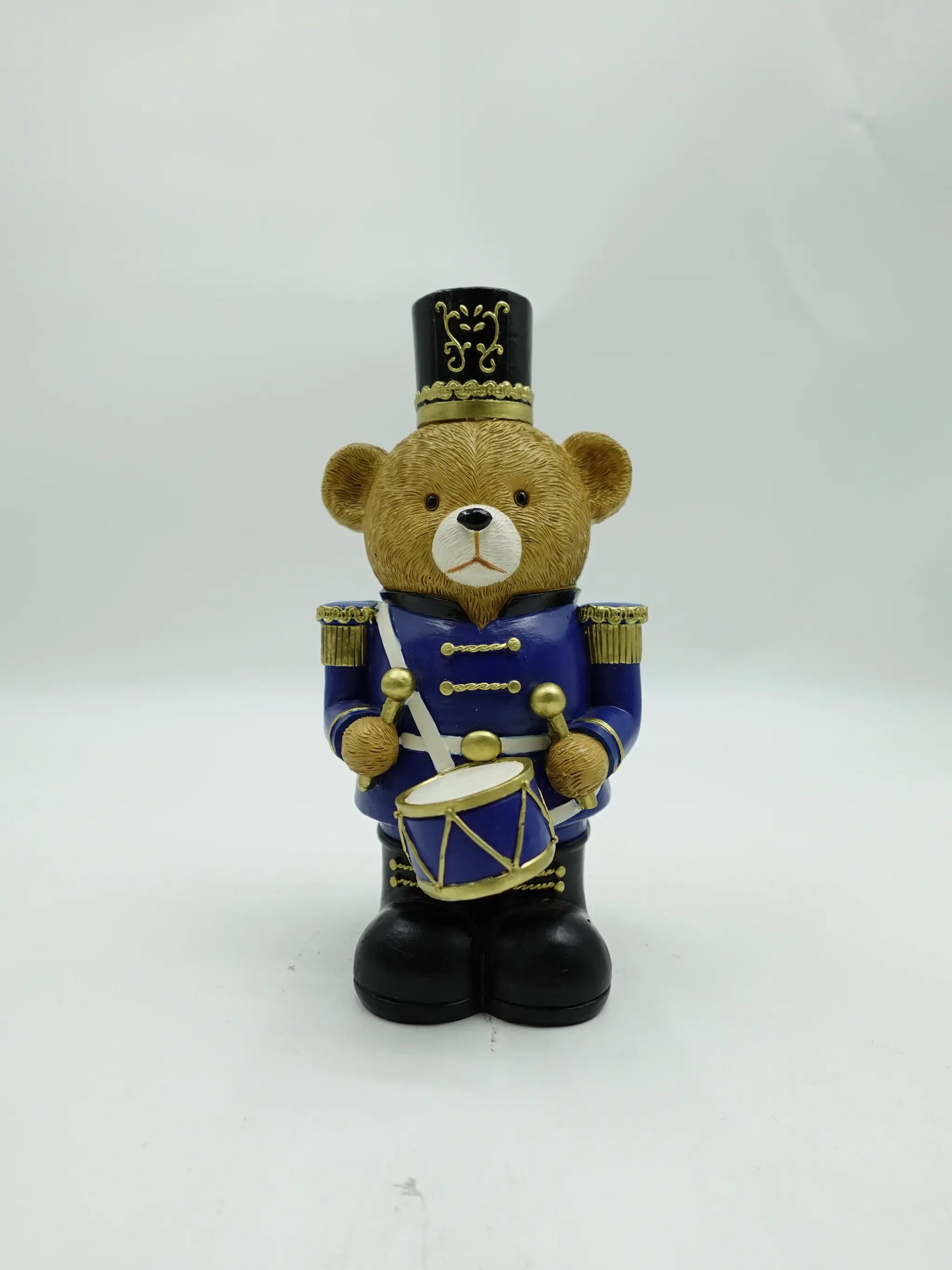 the Christmas teddy bear drummer figurine in blue uniform, front view