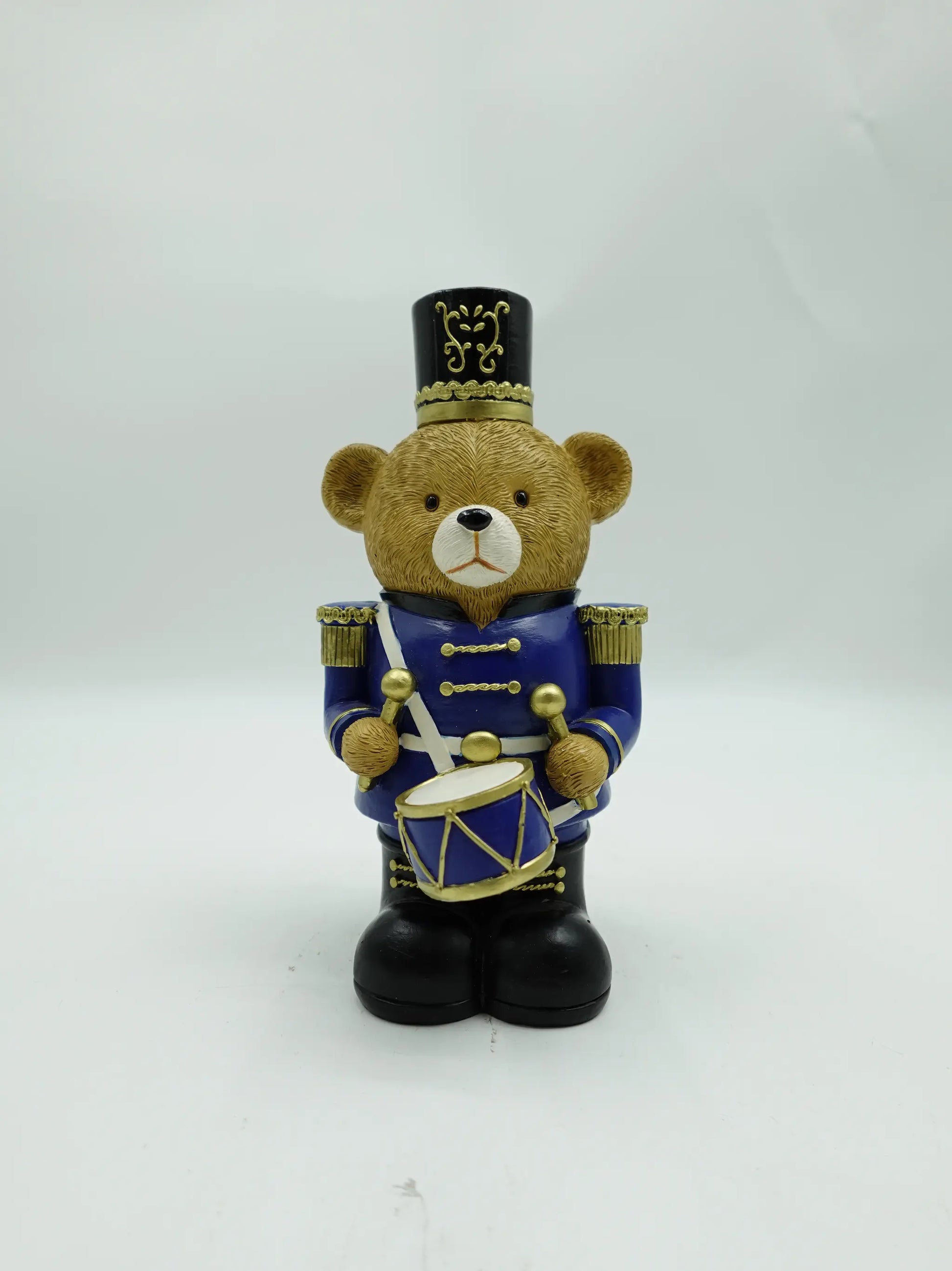 the Christmas teddy bear drummer figurine in blue uniform, front view
