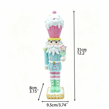 Hand-painted cupcake nutcracker figurine with candyland theme, 31cm tall, front view with dimensions