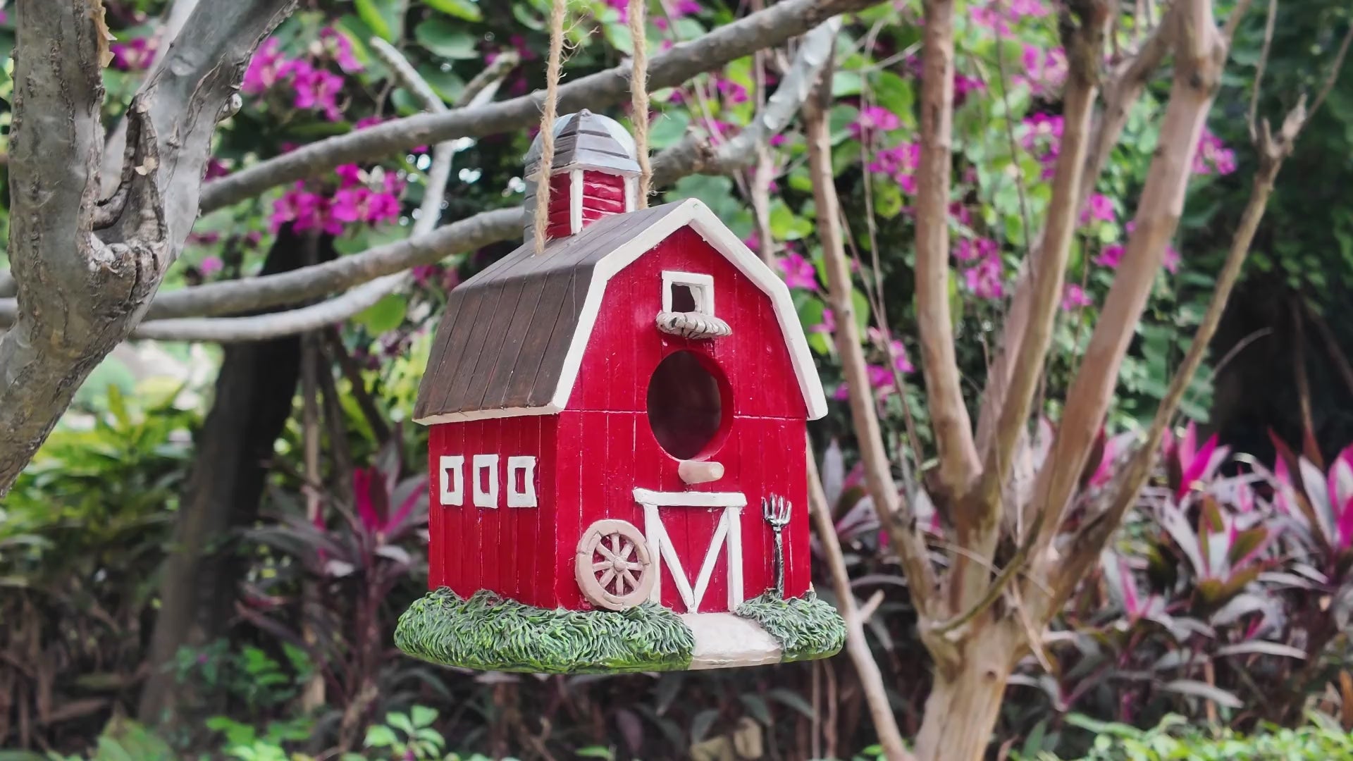 video of red resin birdhouse hand-painted