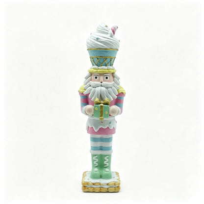 Hand-painted nutcracker figurine styled like a candy-themed character, holding a wrapped gift on a plain white background.