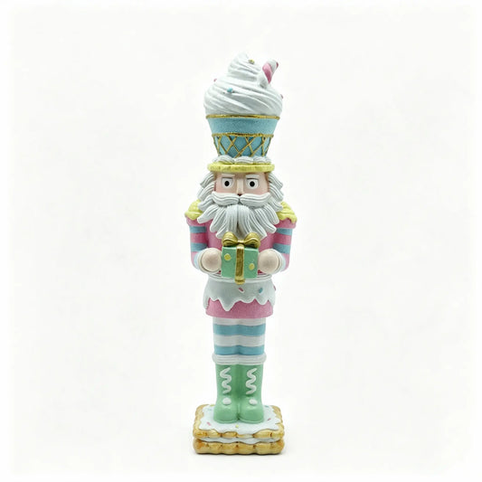 Hand-painted nutcracker figurine styled like a candy-themed character, holding a wrapped gift on a plain white background.