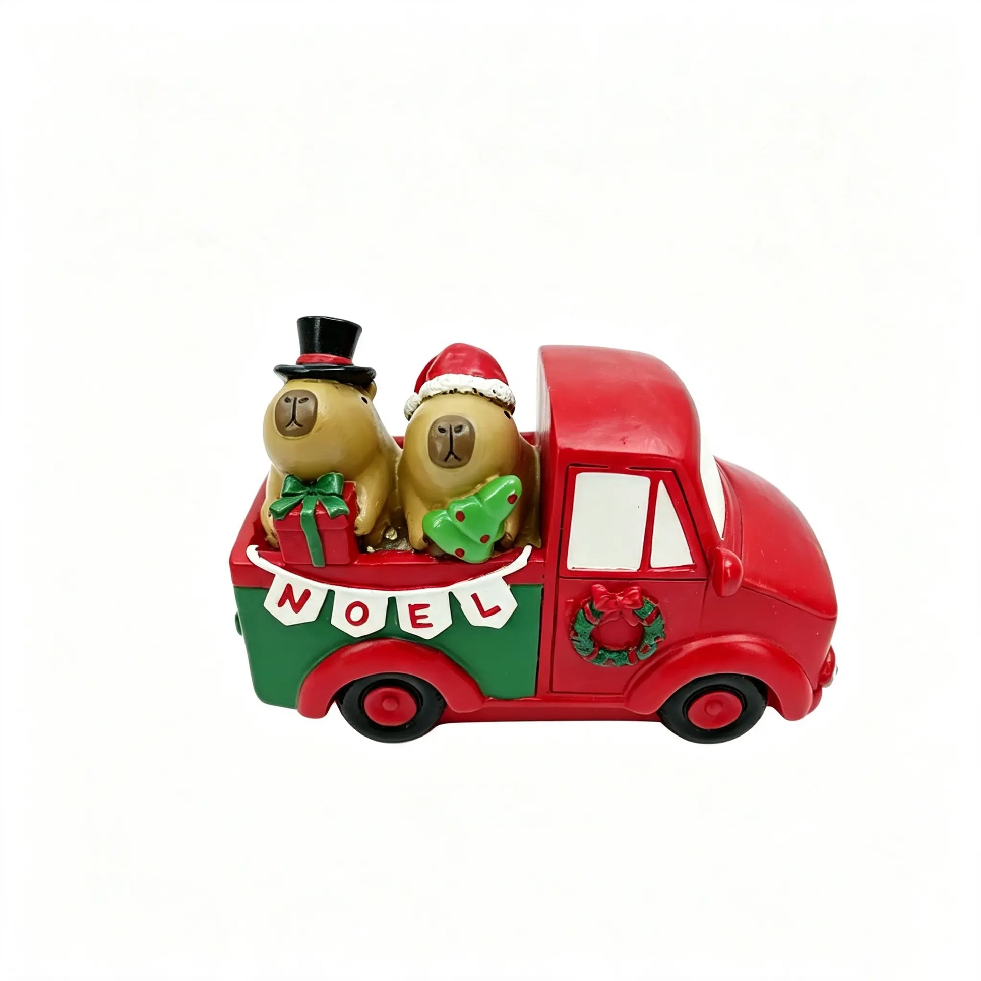 Hand-painted Christmas capybara couple in a vintage red and green truck with NOEL banner, wreath, gift box, and mini tree on white background